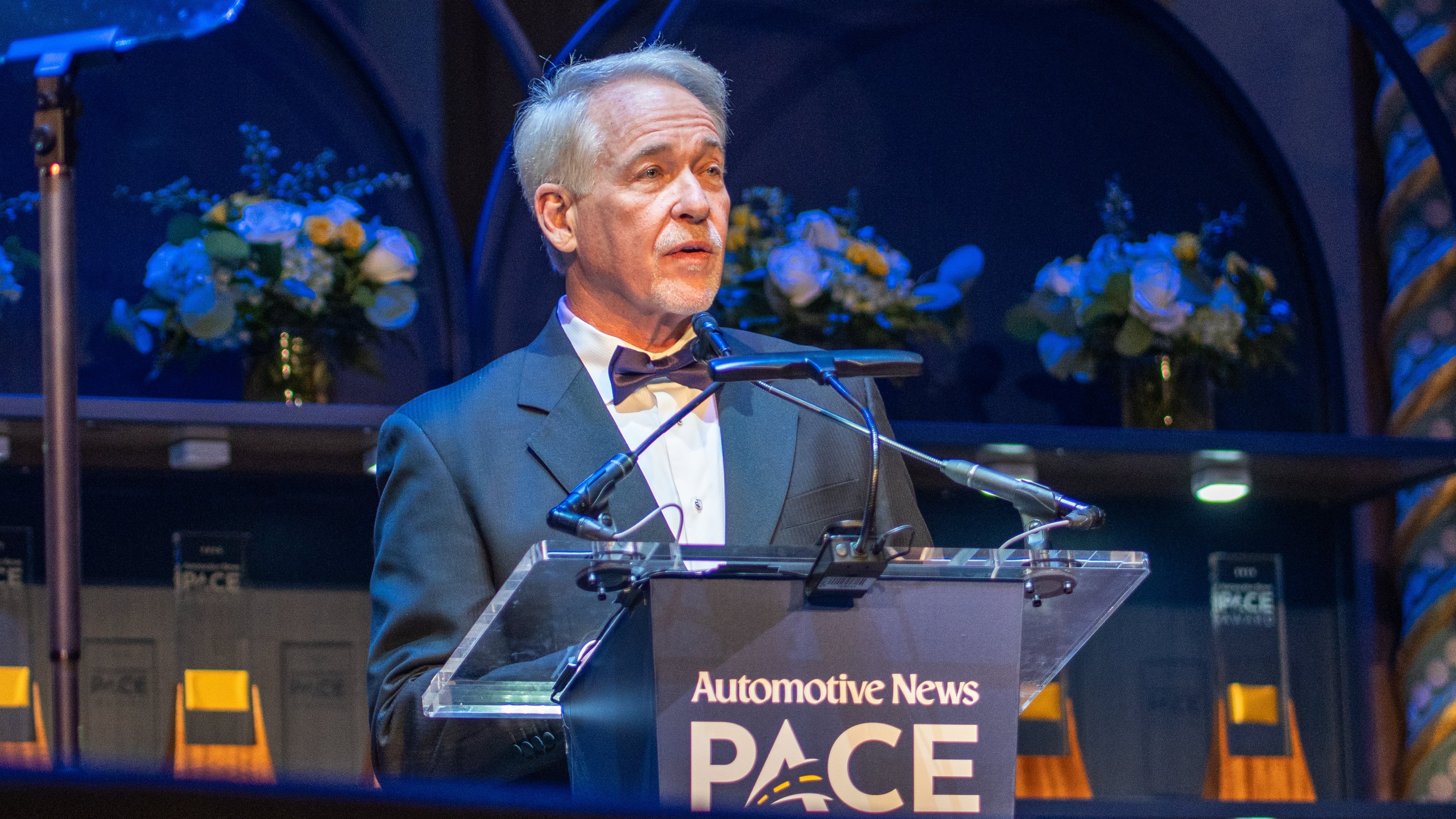 WarrCloud CEO Jim Roche accepts an Automotive News PACE Award for his warranty claims processing platform.