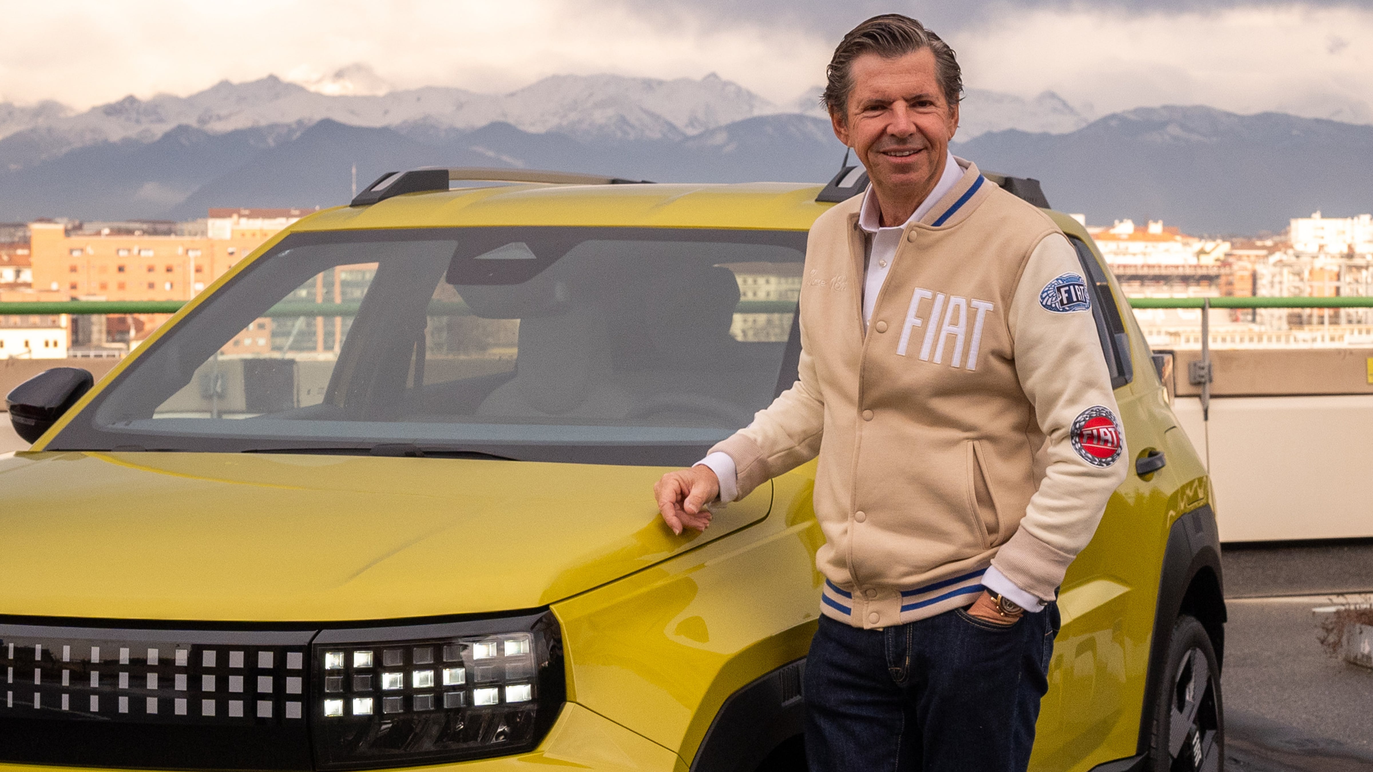 Fiat CEO Olivier Francois stand in front of a yellow Grande Panda in Turin