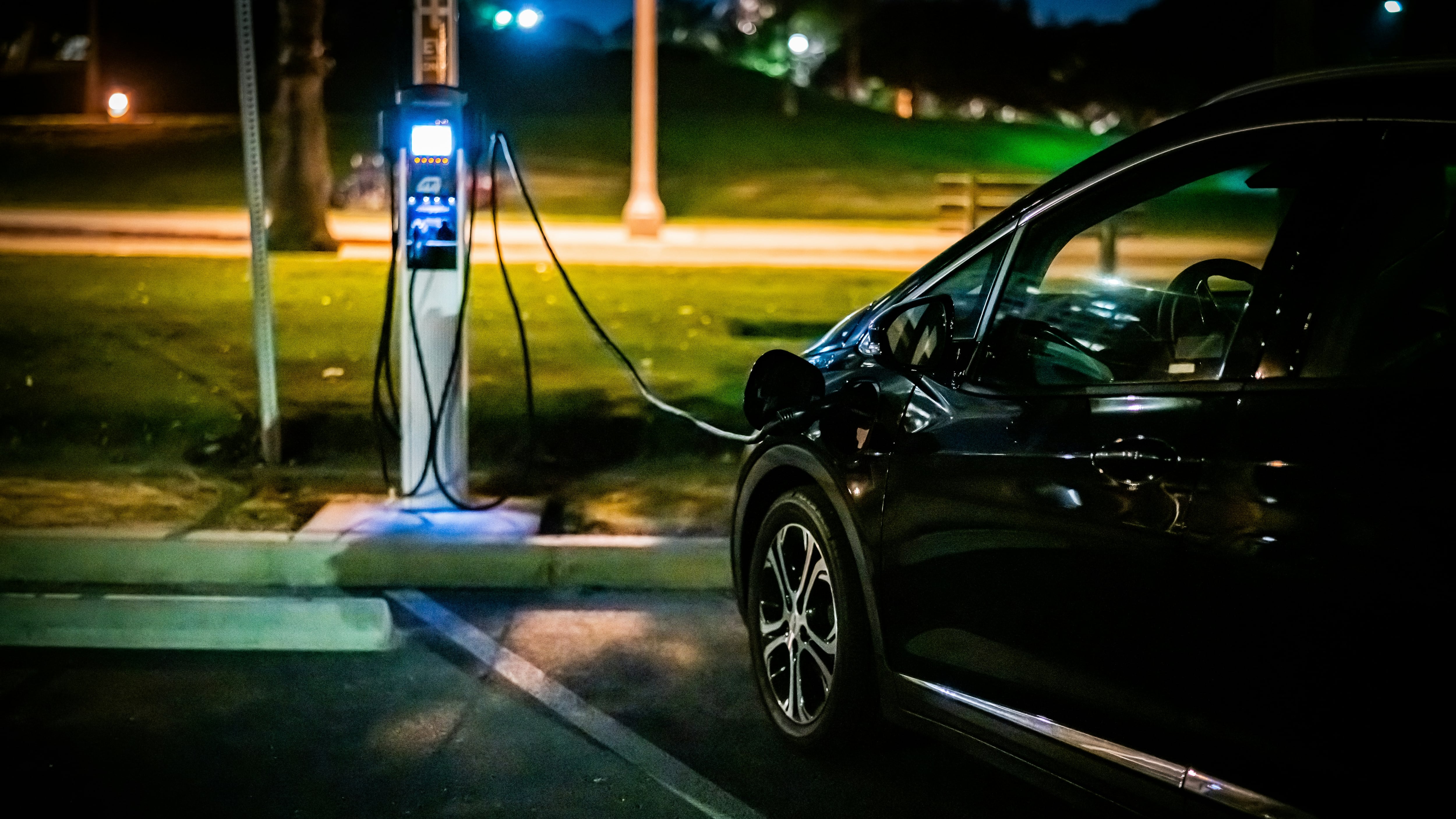 An EV charging at a charging station